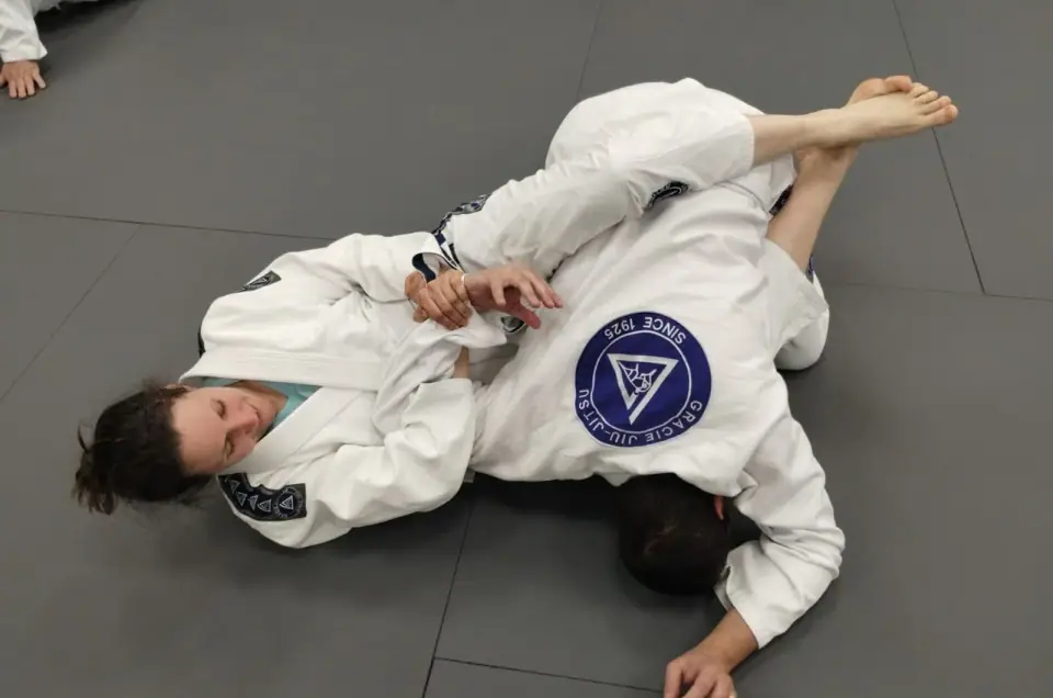 A student applying an armbar during a Gracie Jiu Jitsu St. Nicolas class