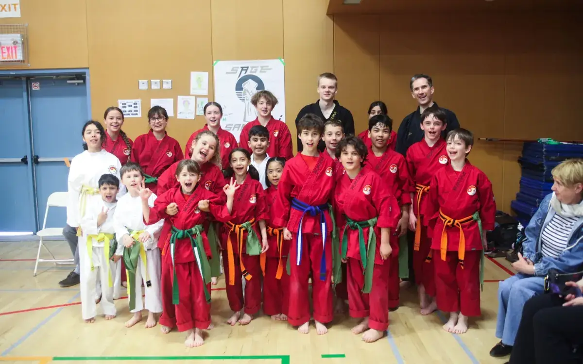 Students in red uniforms with their instructors at Port Credit Academy of Martial Arts