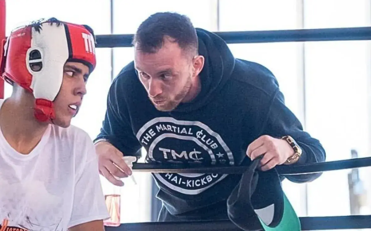 Constantin coaching a young fighter ringside at The Martial Club